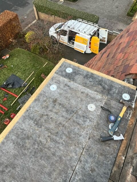 A picture of a dormer flat roof being repaired by Prestige Roofing in Edinburgh. Often a source of problems for homeowners, we can advise on the best materials for new roofs and the best approach for repairing problems.